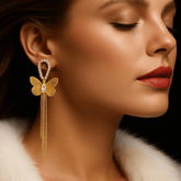 Radiant golden butterfly with chain earring