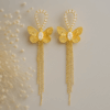 Radiant golden butterfly with chain earring